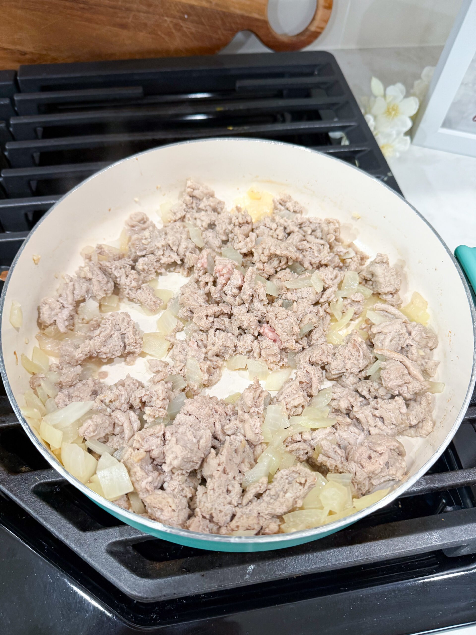 ground turkey and onion cooking in a skillet