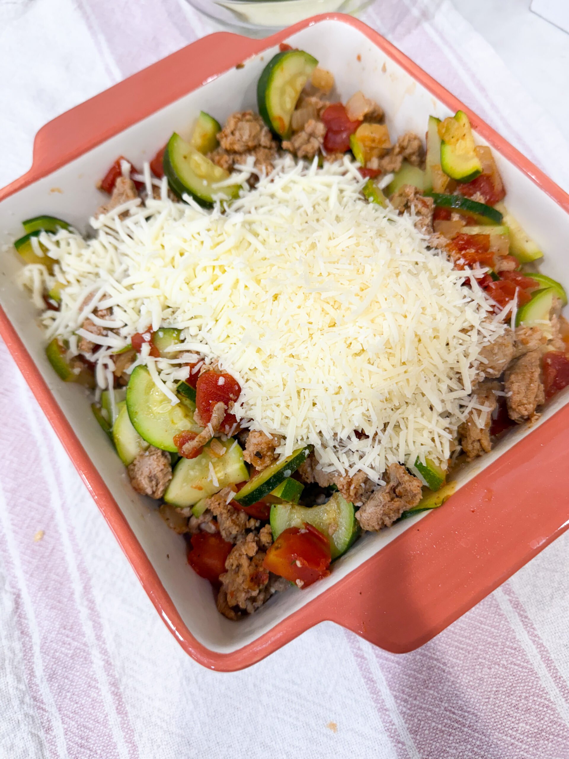cheese spread over the top of the baking dish