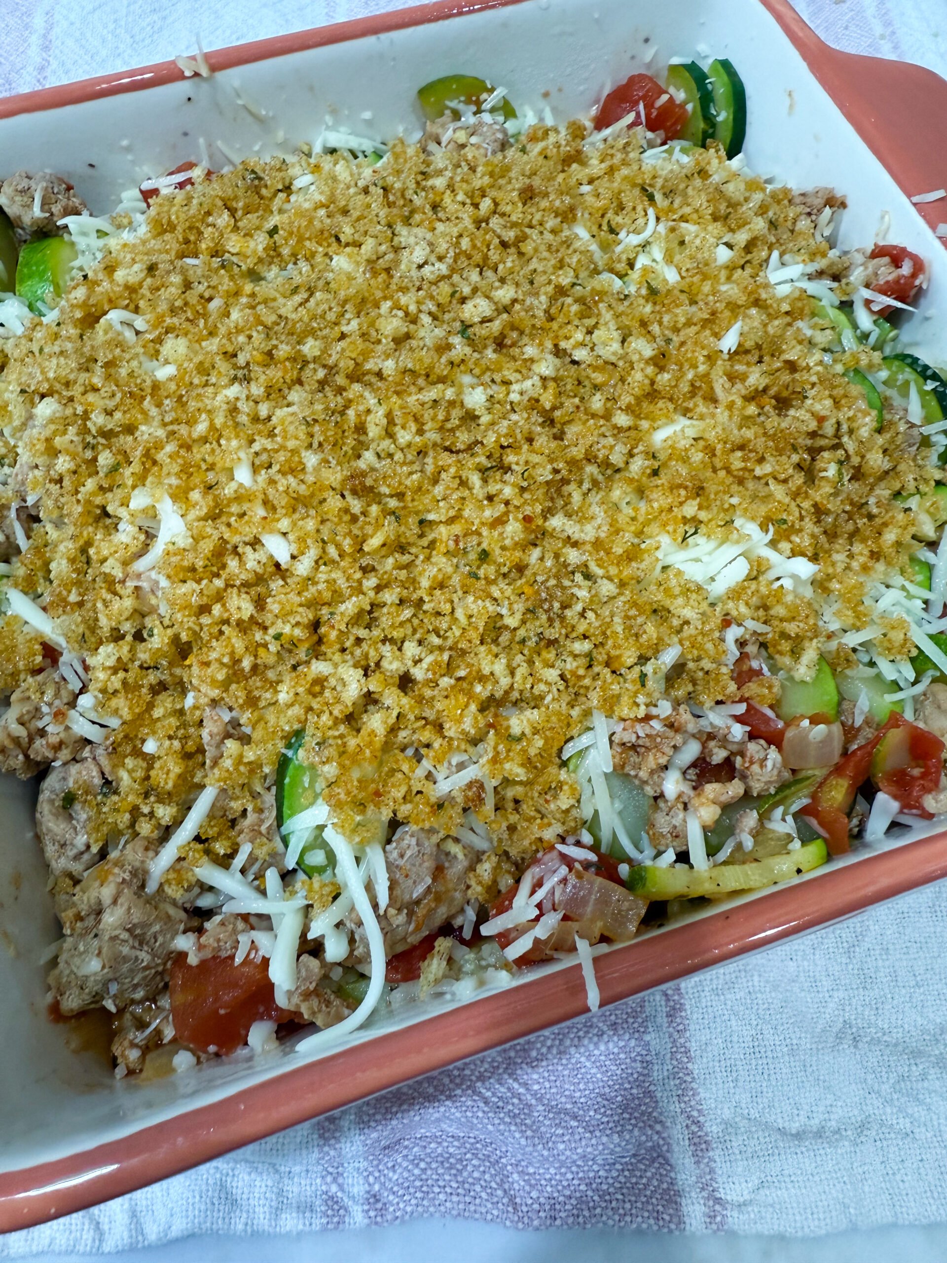 unbaked zucchini casserole with breadcrumb topping