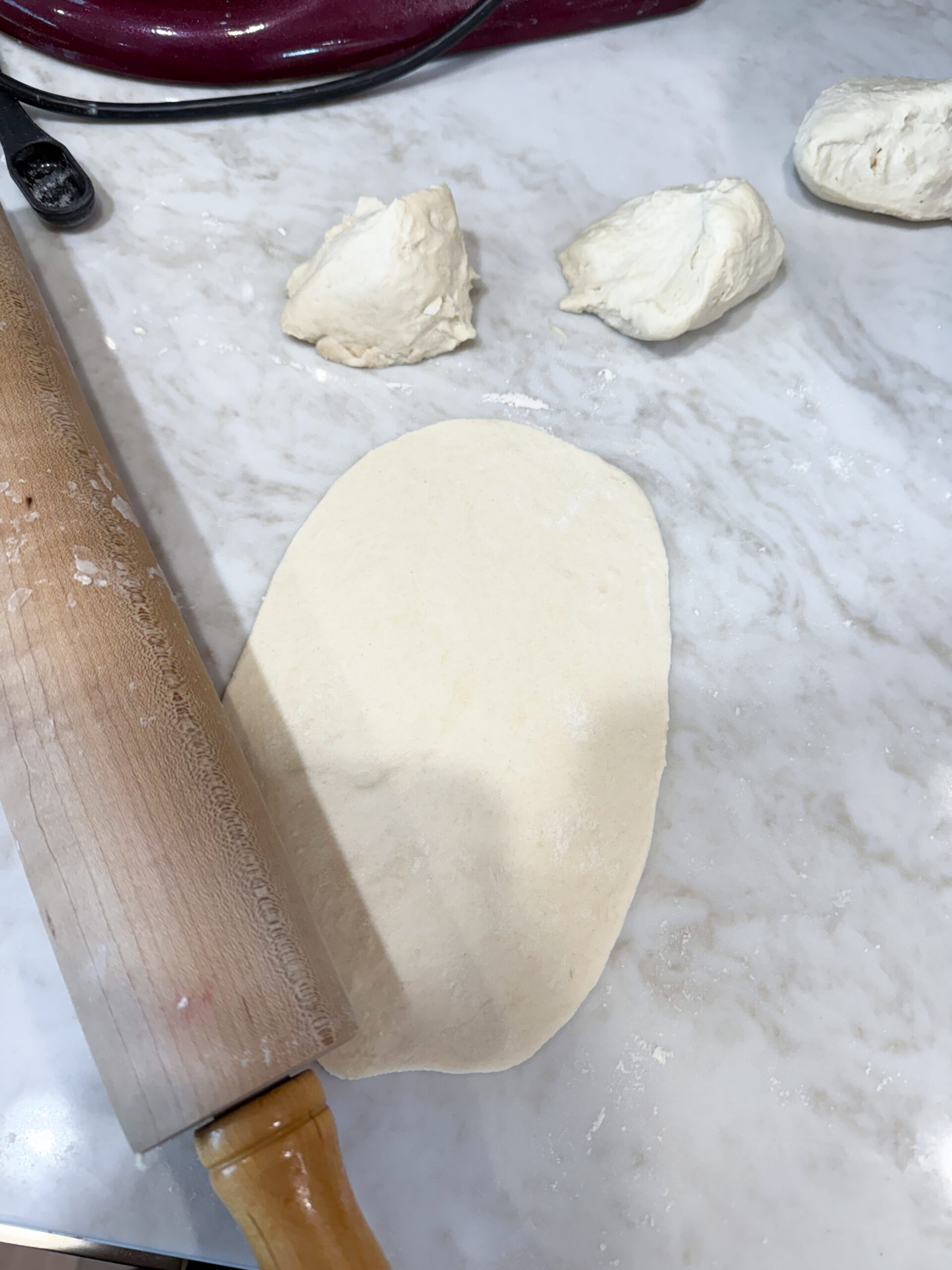 rolled naan dough on the countertop