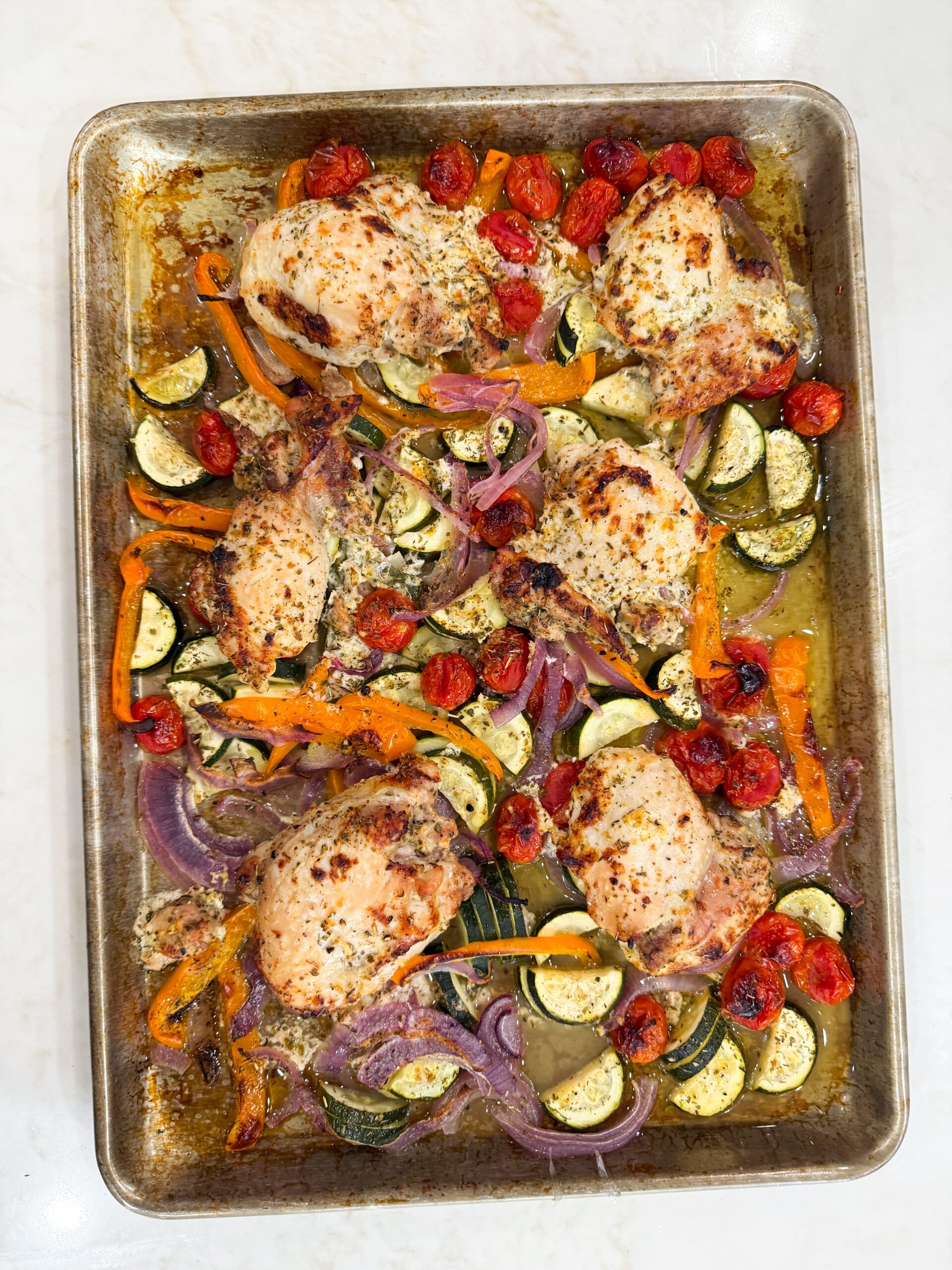 Greek chicken dinner on sheet pan