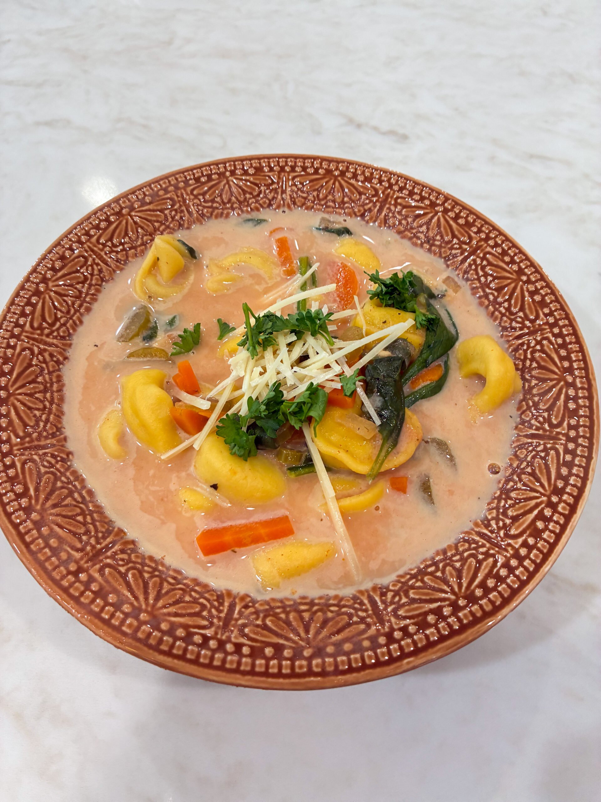 tortellini vegetable soup in a bowl