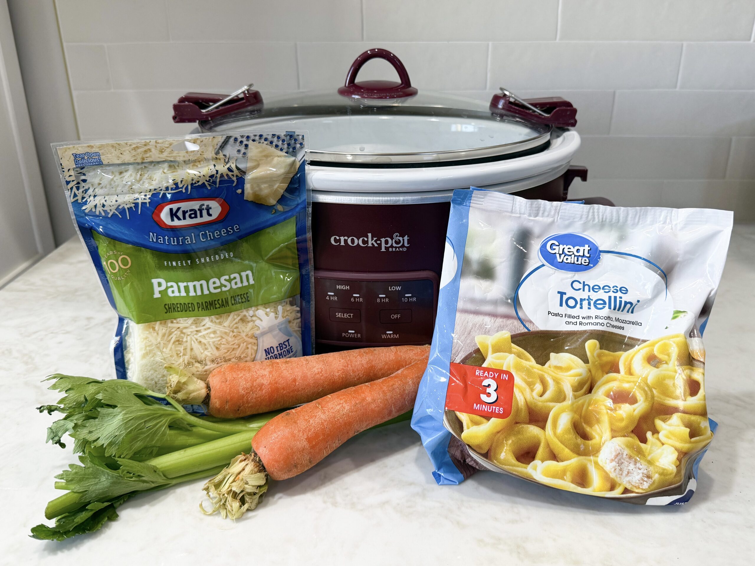 vegetables broth and tortellini on a counter