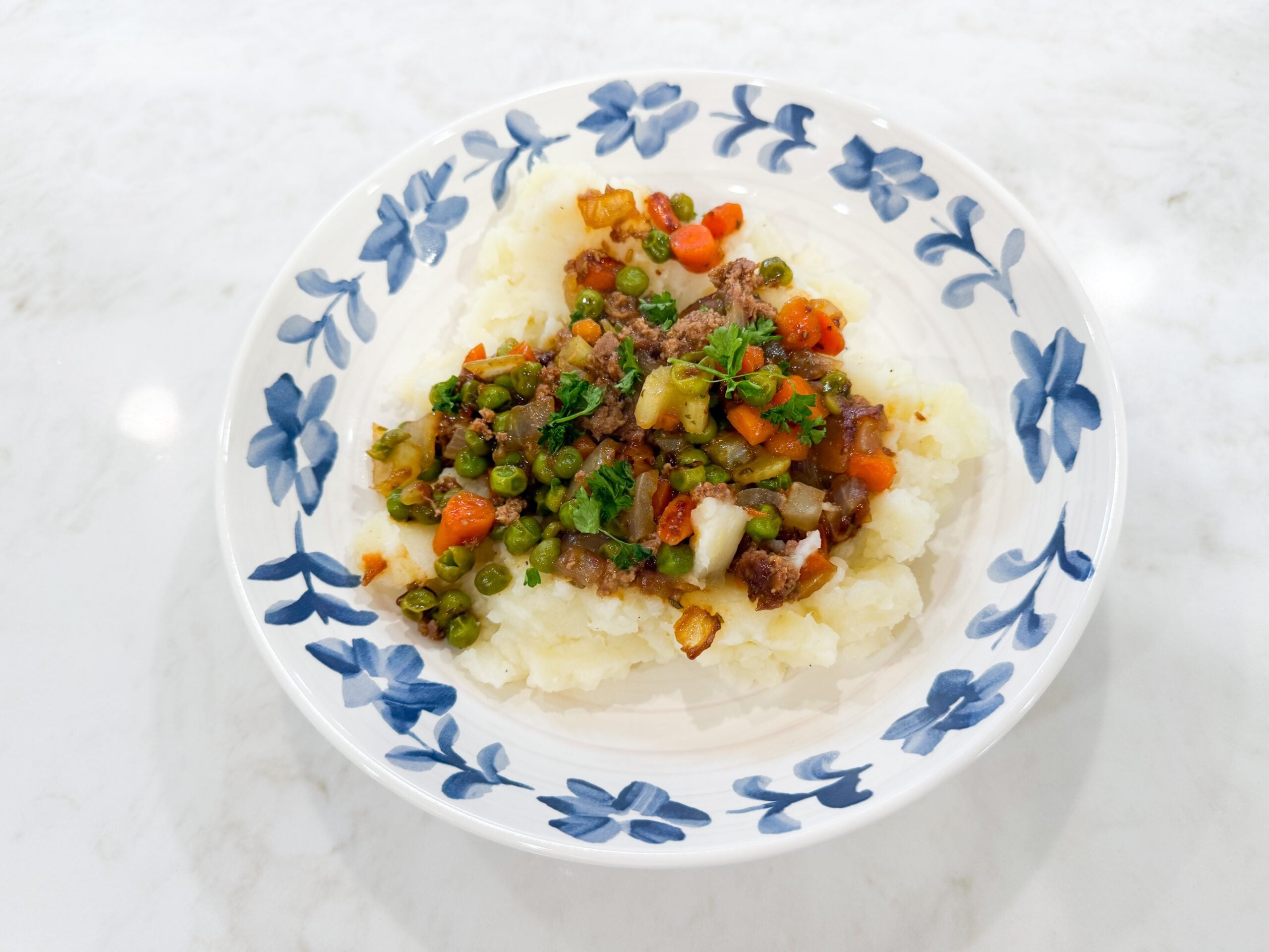 Stovetop shepherd’s pie bowls with ground turkey, vegetables, and mashed potatoes.