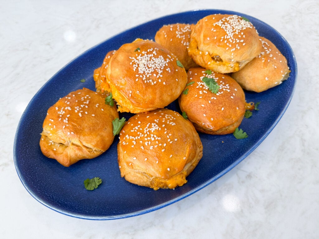 Sausage and cheese stuffed biscuits baked until golden brown